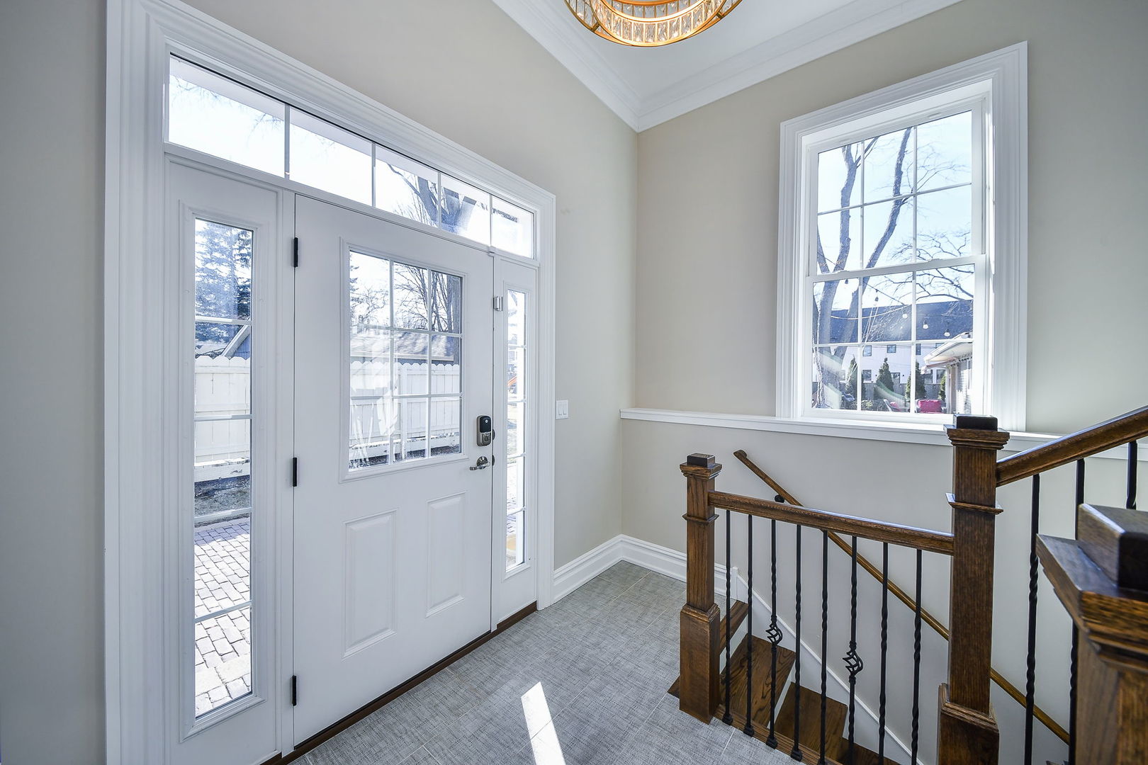325 North Wright Street Naperville, IL 60540 - Photo 30 of 53 a view of an entryway with wooden floor and windows