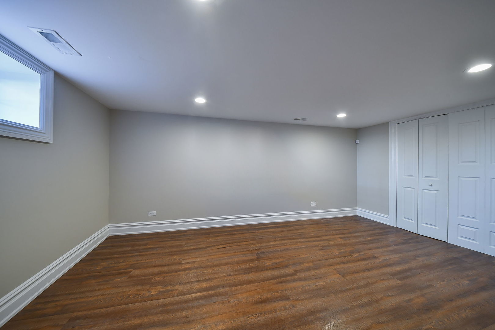 325 North Wright Street Naperville, IL 60540 - Photo 34 of 53 a view of an empty room with wooden floor