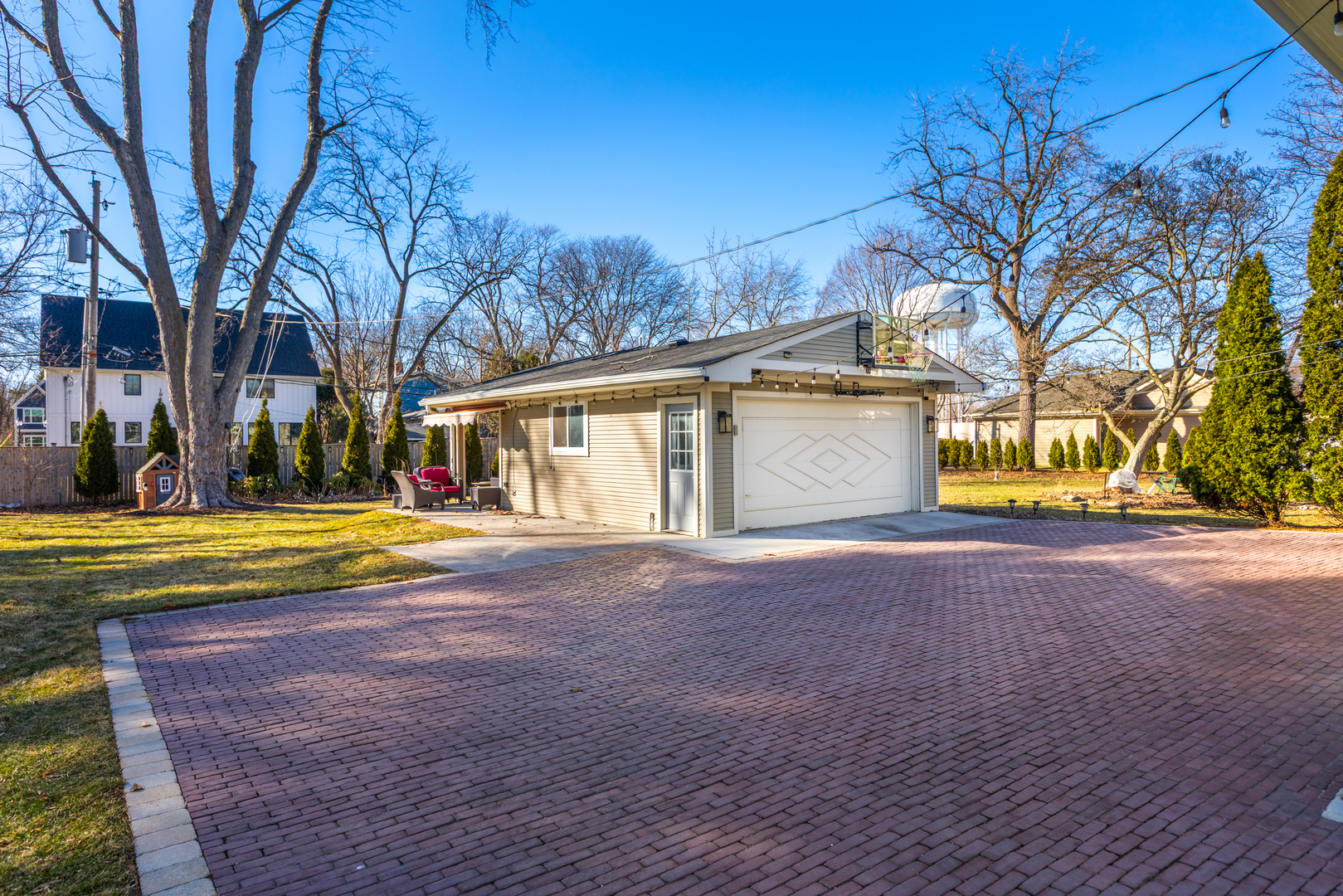 325 North Wright Street Naperville, IL 60540 - Photo 37 of 53 a view of a house with a yard and a large tree