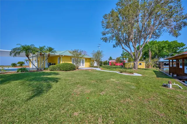a living room with a bed furniture and a window