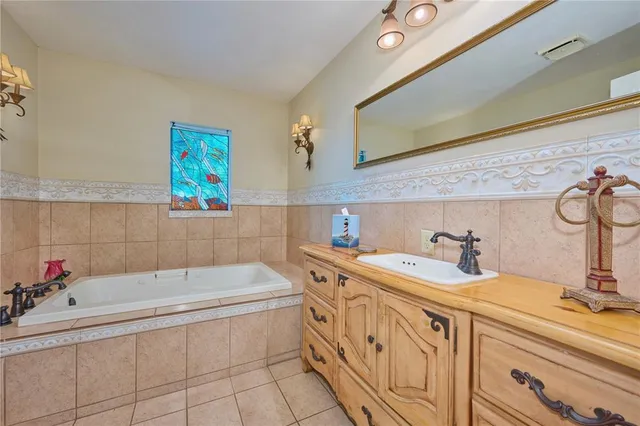 a utility room with cabinets dryer and washer