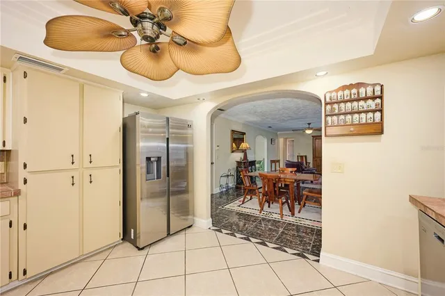 a living room with fireplace furniture and a rug