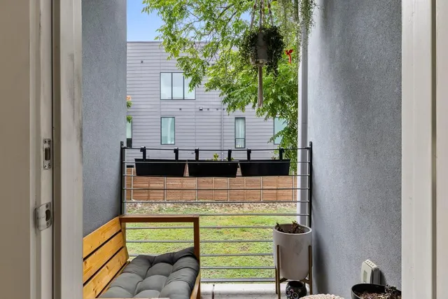 a view of a hallway with paintings on the wall