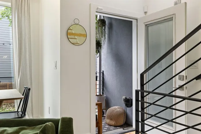 a bathroom with a toilet a sink a tub and mirror