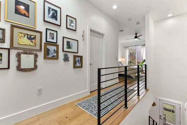 a bedroom with bed and a chandelier
