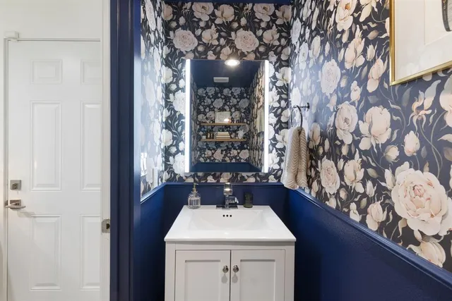 a bathroom with a sink and vanity