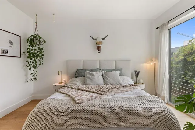 a view of a building with potted plants