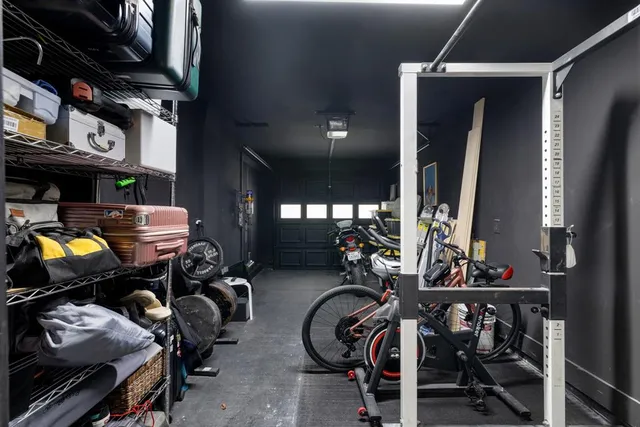 a kitchen with a sink a counter space appliances and cabinets