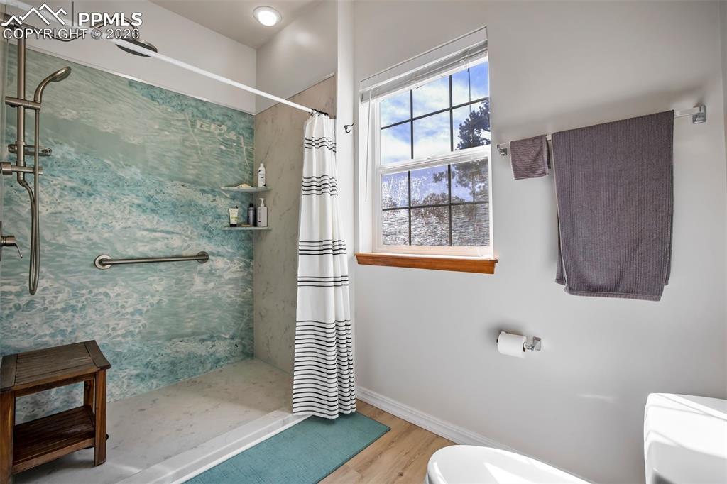 18554 Wetherill Road Monument, CO 80132 - Photo 26 of 50 a bathroom with a toilet and a shower