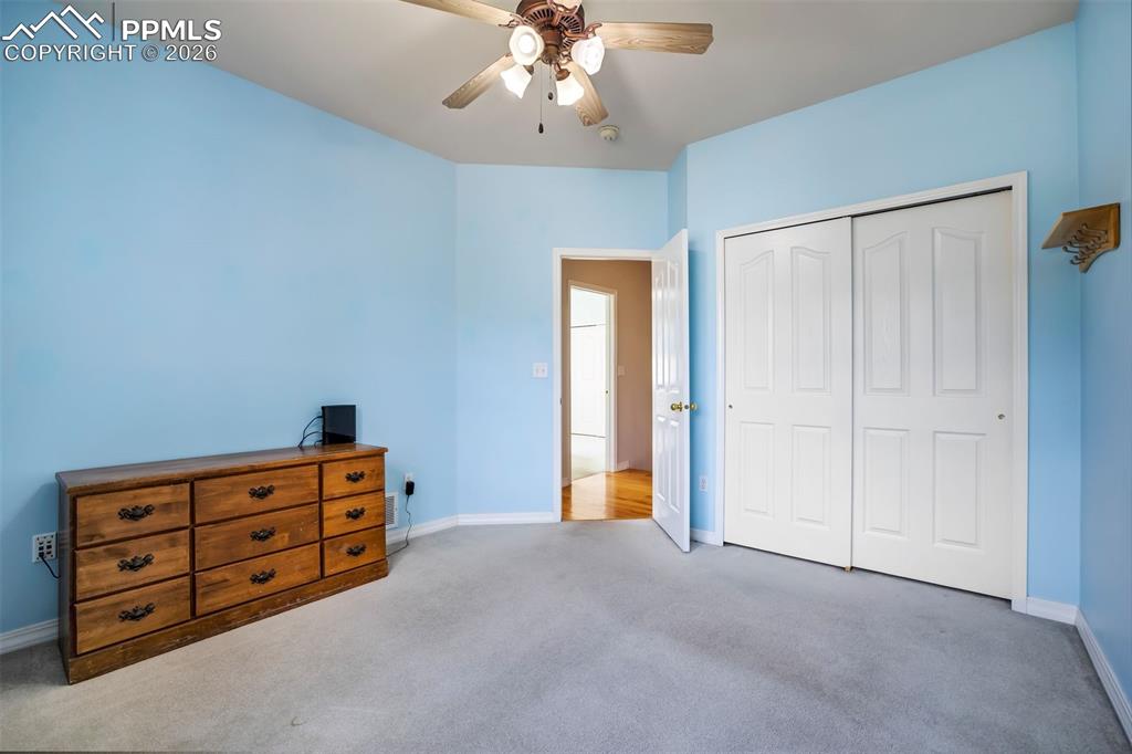 18554 Wetherill Road Monument, CO 80132 - Photo 29 of 50 a view of room with cabinet and ceiling fan