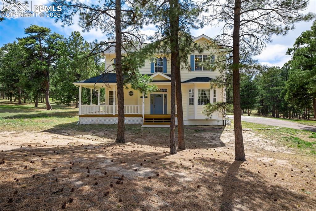 18554 Wetherill Road Monument, CO 80132 - Photo 3 of 50 a view of a house with backyard view