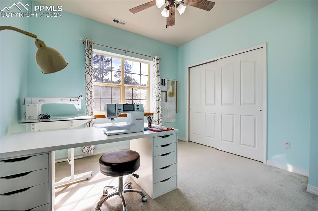 18554 Wetherill Road Monument, CO 80132 - Photo 33 of 50 a kitchen with a chandelier and a sink