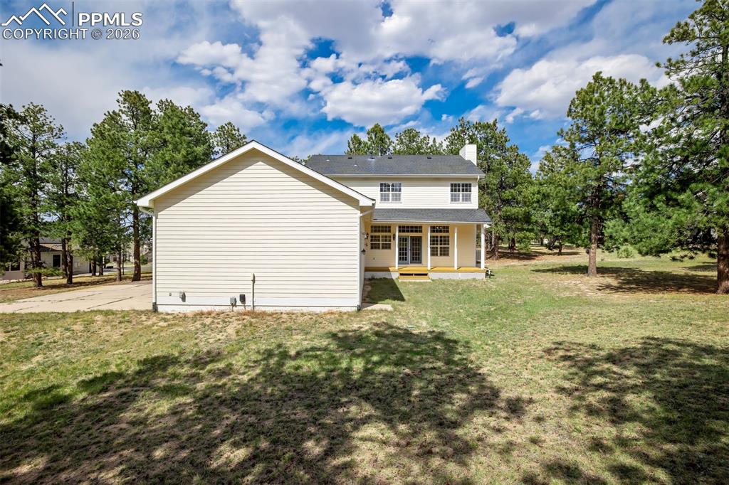 18554 Wetherill Road Monument, CO 80132 - Photo 40 of 50 a front view of a house with a yard