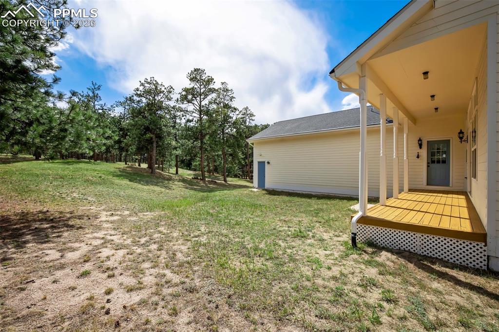 18554 Wetherill Road Monument, CO 80132 - Photo 43 of 50 a backyard of a house with lots of green space