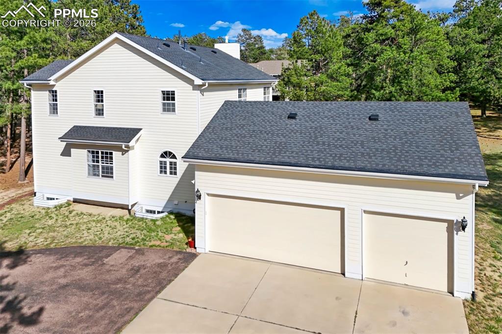 18554 Wetherill Road Monument, CO 80132 - Photo 45 of 50 front view of house with a yard