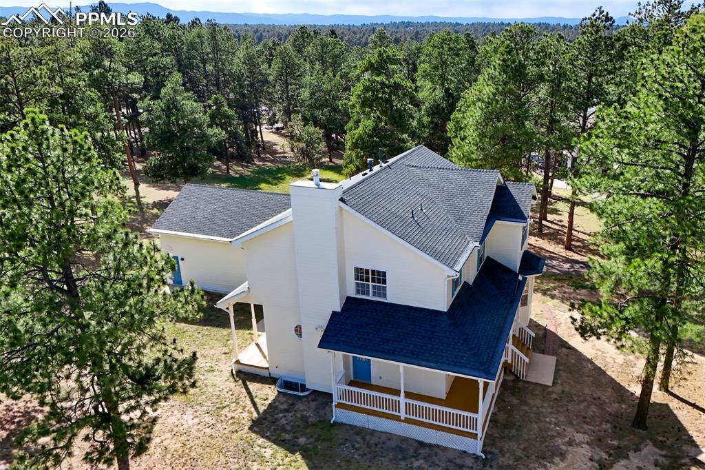 18554 Wetherill Road Monument, CO 80132 - Photo 48 of 50 aerial view of a house with a yard balcony and furniture
