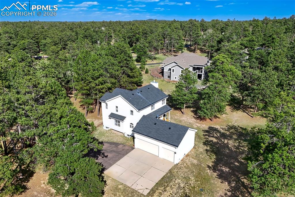 18554 Wetherill Road Monument, CO 80132 - Photo 50 of 50 an aerial view of a house with a yard