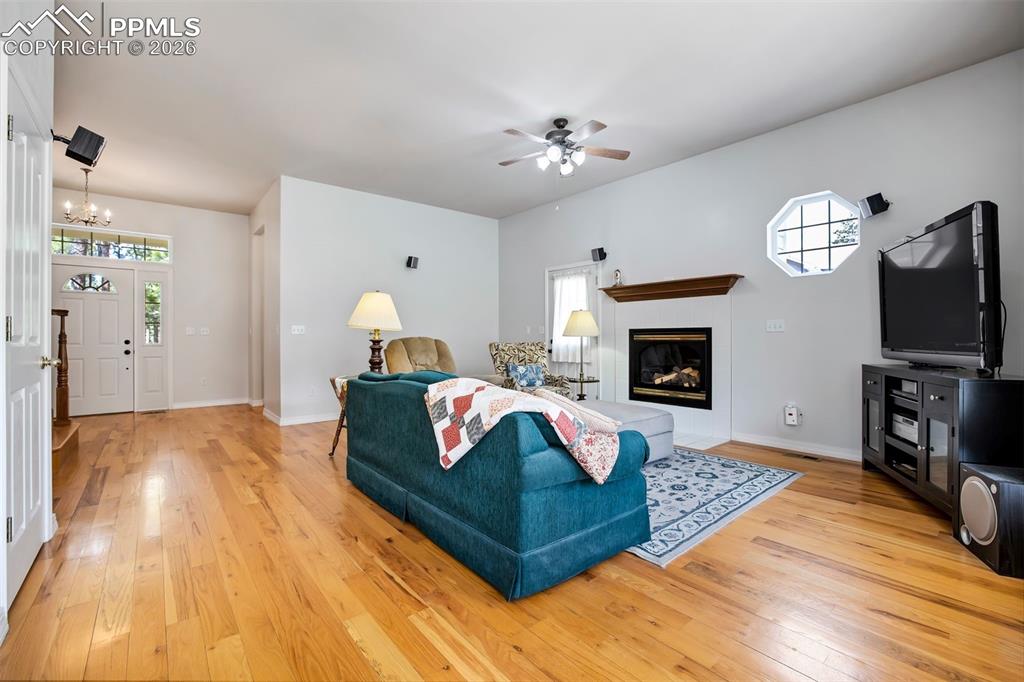 18554 Wetherill Road Monument, CO 80132 - Photo 6 of 50 a living room with furniture fireplace and flat screen tv