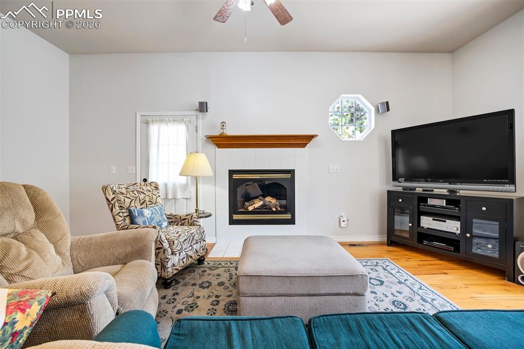 18554 Wetherill Road Monument, CO 80132 - Photo 8 of 50 a living room with furniture and a flat screen tv