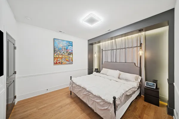 a bedroom with a large bed and a large window