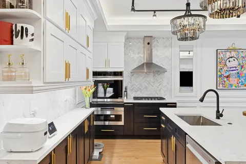 a kitchen with a sink cabinets and window