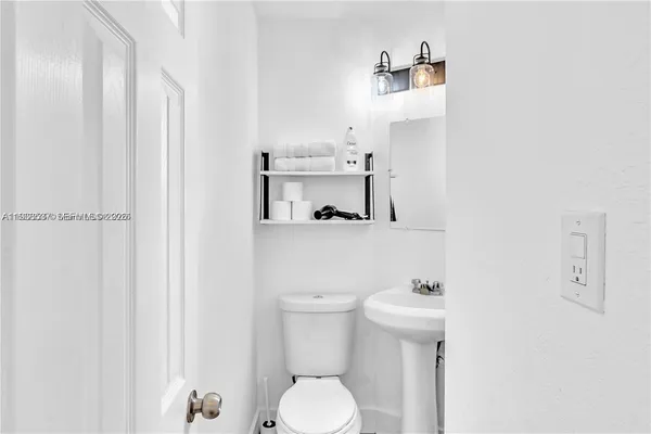 a bathroom with a toilet and a sink