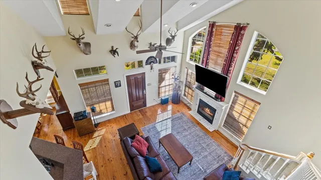 a view of a dining room with furniture and chandelier