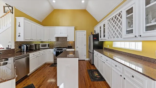 a kitchen with a stove a refrigerator and a stove