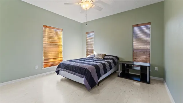 a view of swimming pool with a patio