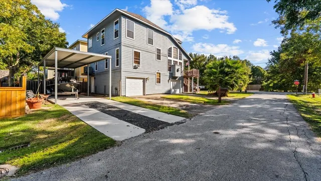 a view of a white house with a swimming pool