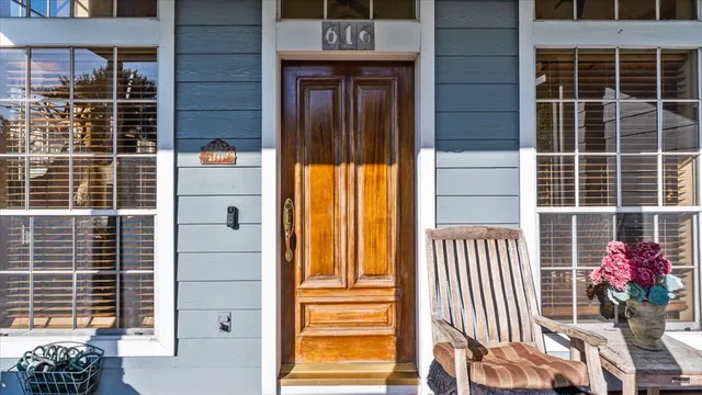 a view of a balcony with wooden floor