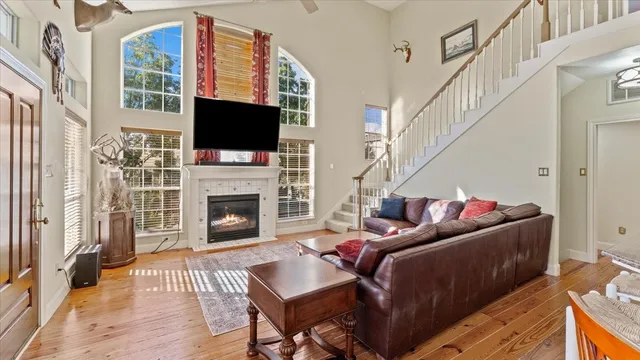 a living room with furniture fireplace and flat screen tv