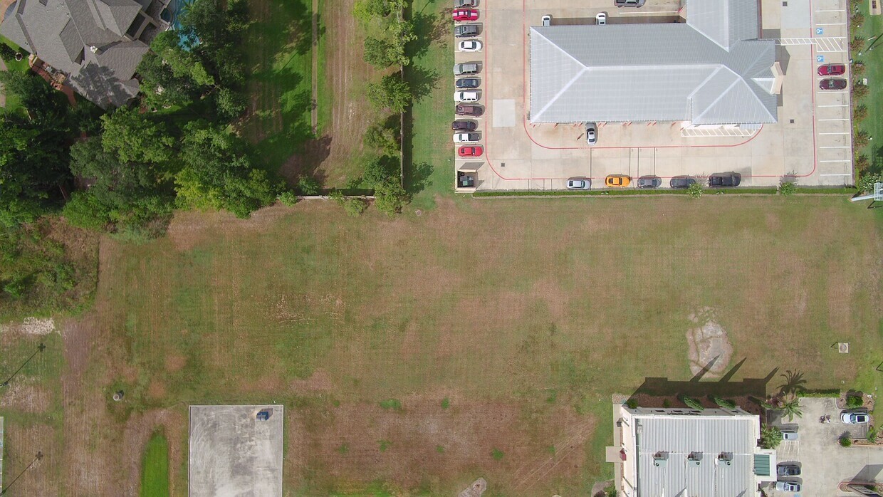 an aerial view of a house with a ocean view