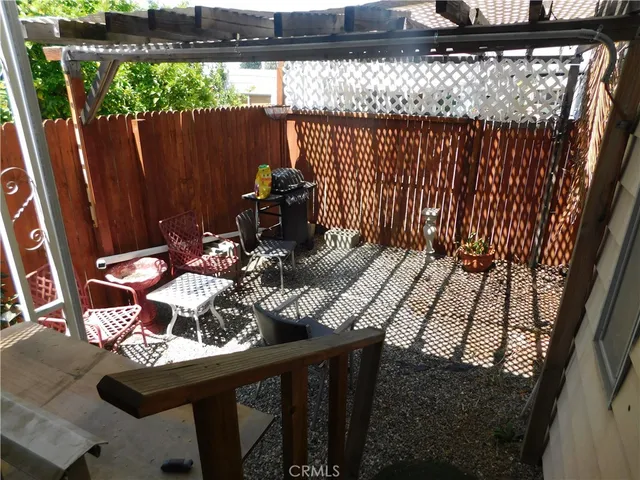 a view of balcony with furniture