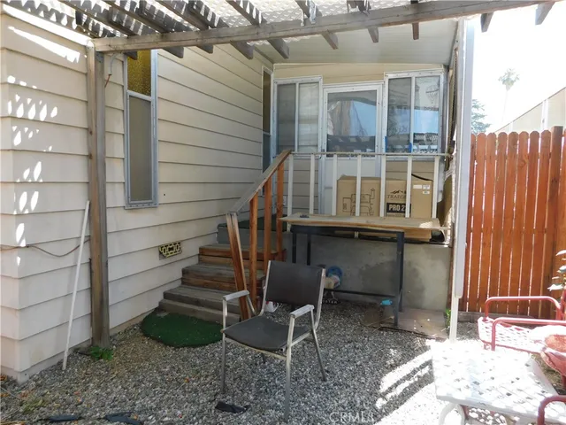 a view of a chair and table in the patio