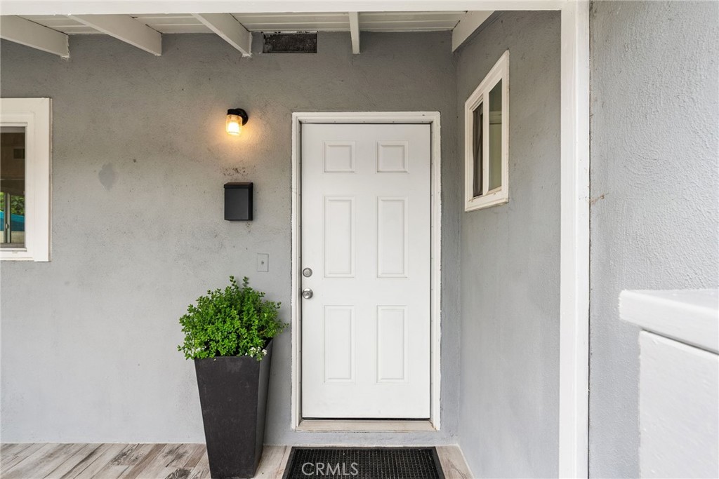 13361 Roxey Drive Garden Grove, CA 92843 - Photo 30 of 31 a potted plant sitting in front of a door