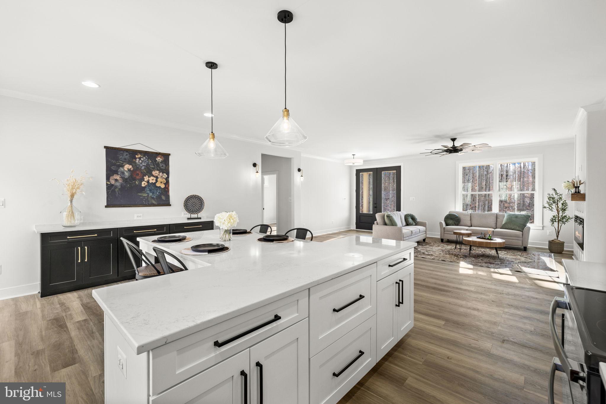 20373 Beaver Crk Court Lignum, VA 22726 - Photo 14 of 61 a view of a kitchen counter space a sink wooden floor and living room view