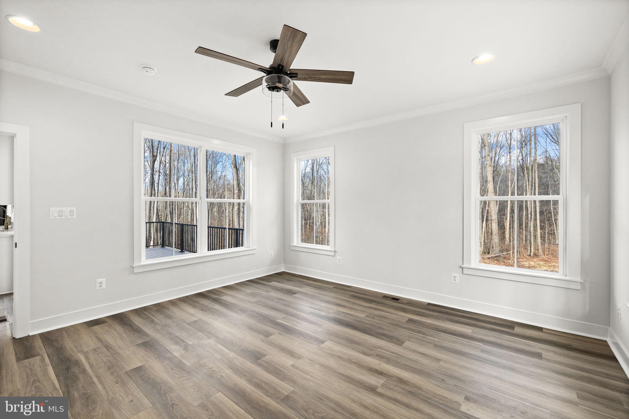 20373 Beaver Crk Court Lignum, VA 22726 - Photo 20 of 61 a view of an empty room with wooden floor and a window
