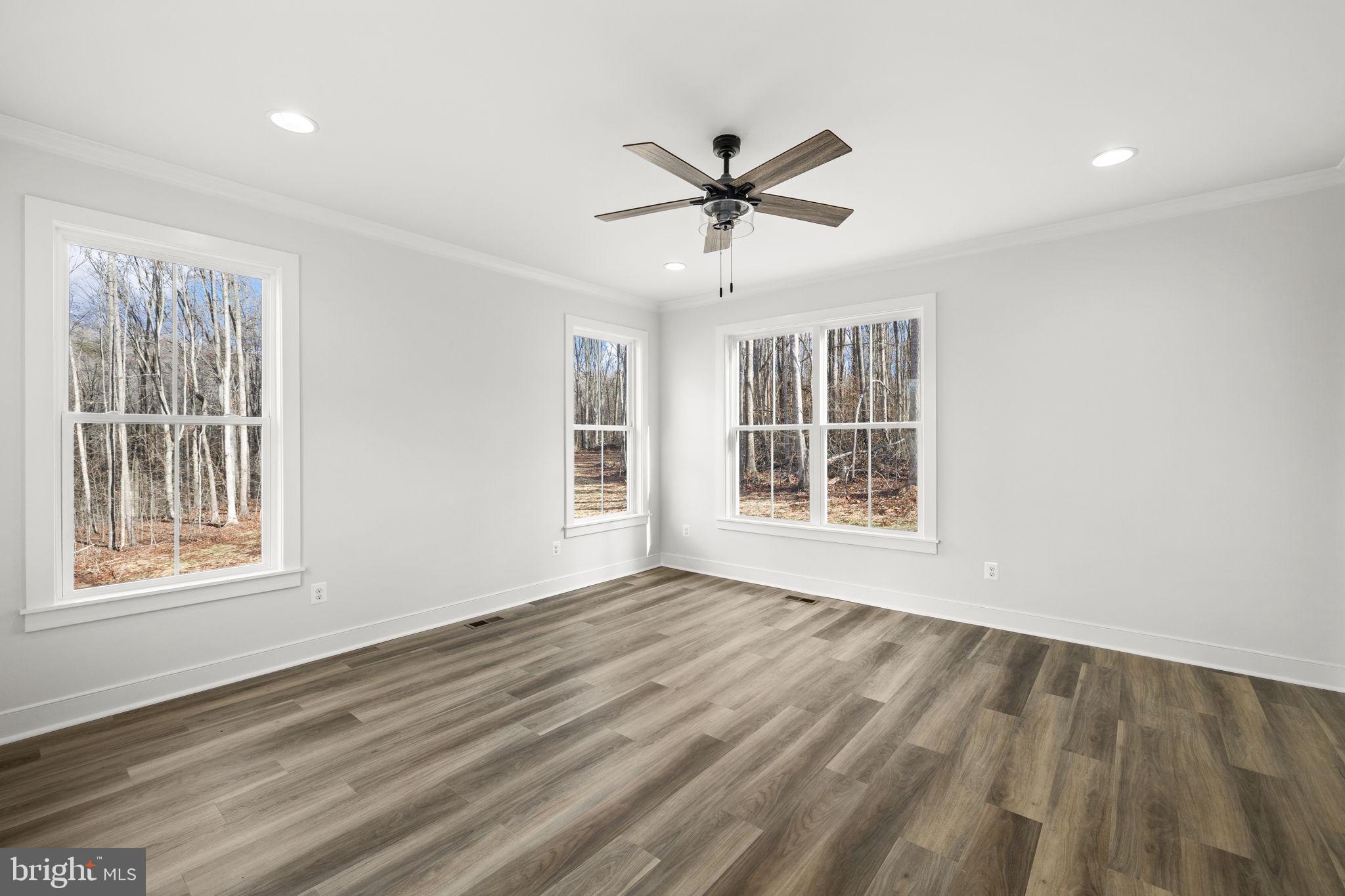 20373 Beaver Crk Court Lignum, VA 22726 - Photo 22 of 61 a view of an empty room with wooden floor and a window