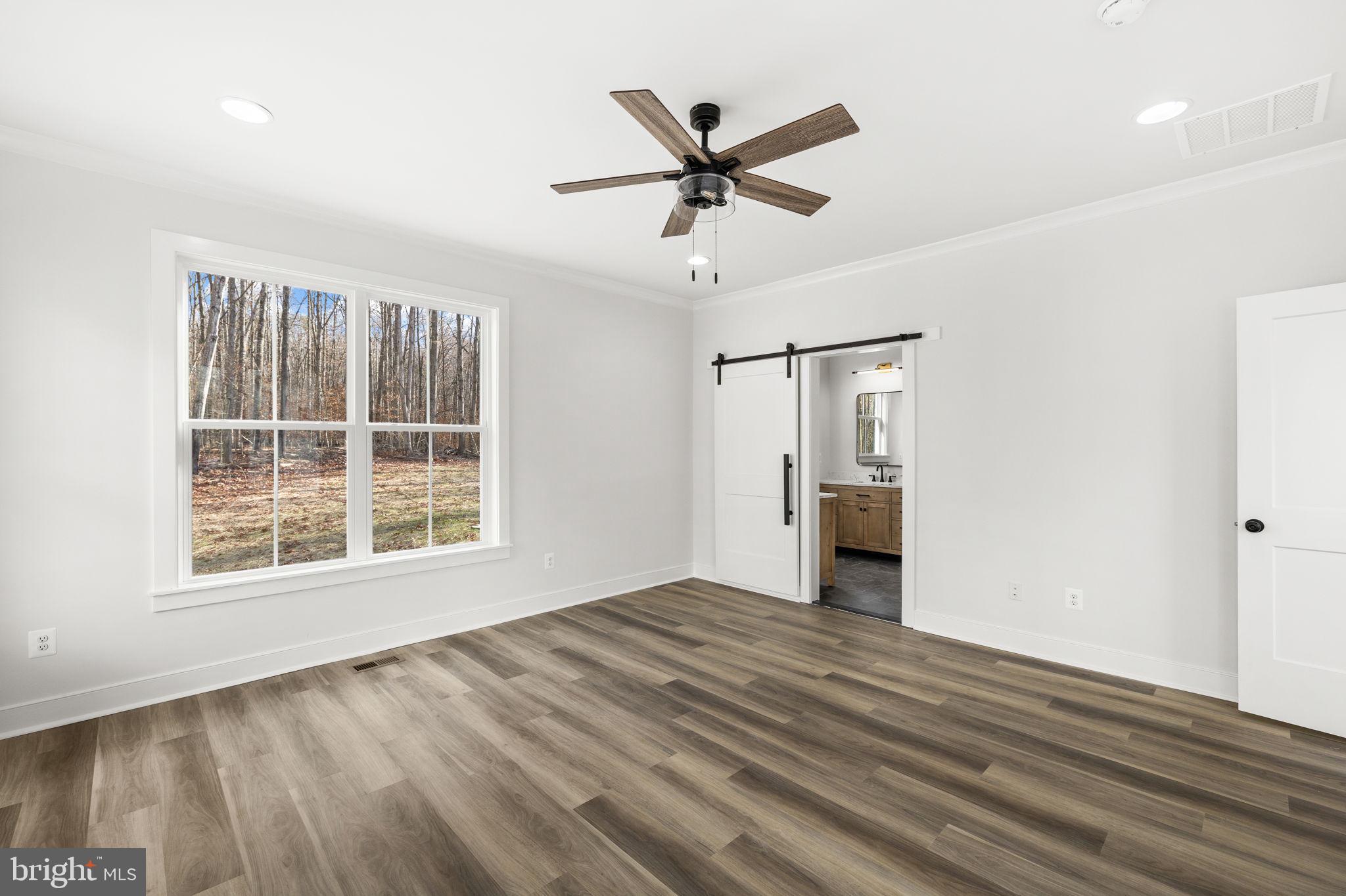 20373 Beaver Crk Court Lignum, VA 22726 - Photo 23 of 61 wooden floor in an empty room with a window