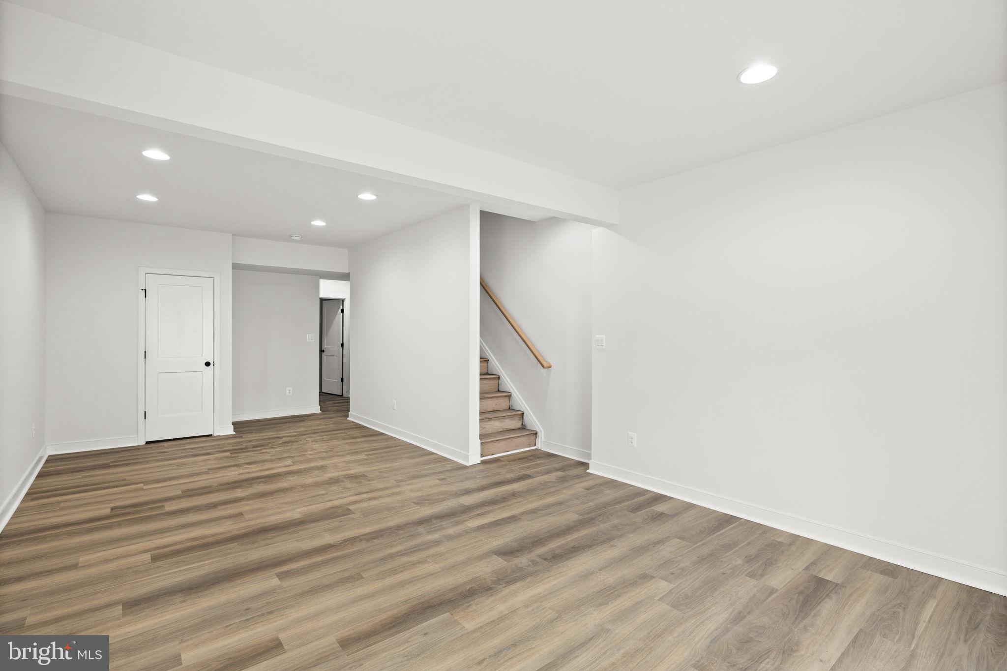 20373 Beaver Crk Court Lignum, VA 22726 - Photo 36 of 61 a view of an empty room with wooden floor and stairs