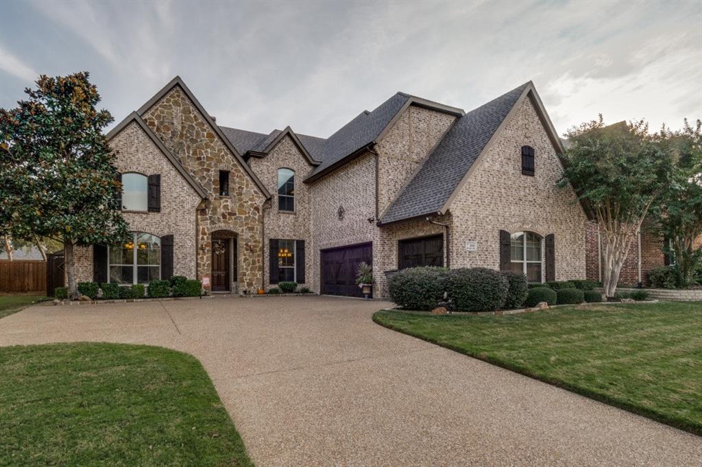 2810 Baker Street Sachse, TX 75048 - Photo 1 of 26 French country style house featuring brick siding, driveway, roof with shingles, and stone siding