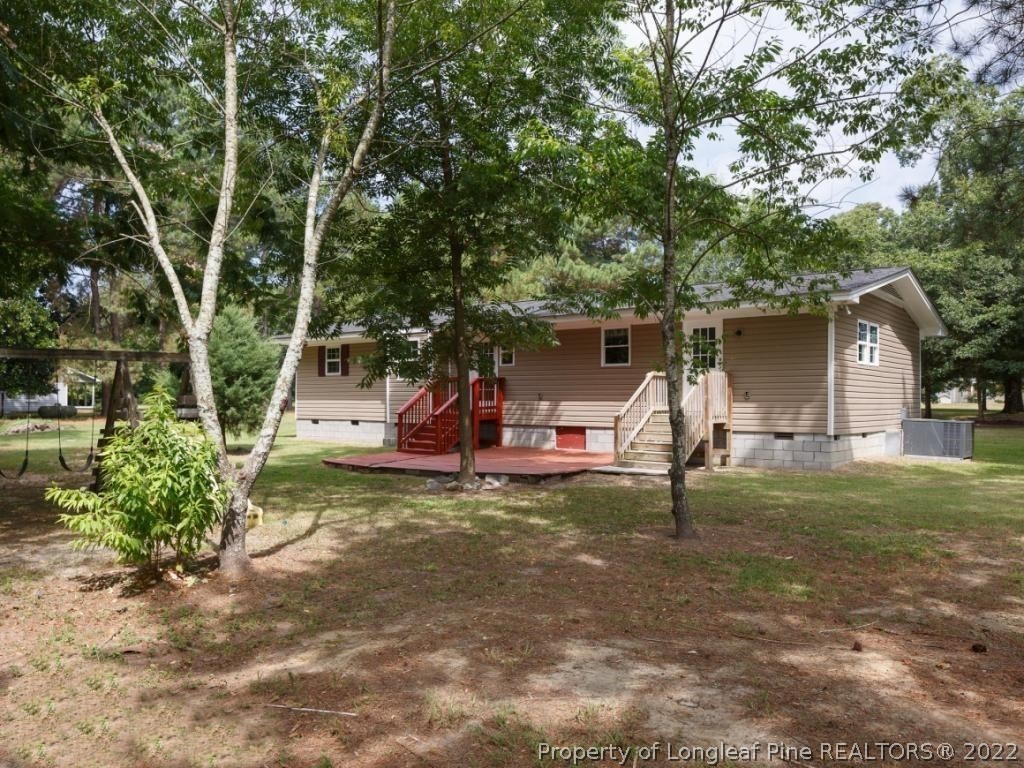 7661 Rufus Johnson Road, Unit 2 Fayetteville, NC 28306 - Photo 12 of 14 a view of a house with backyard