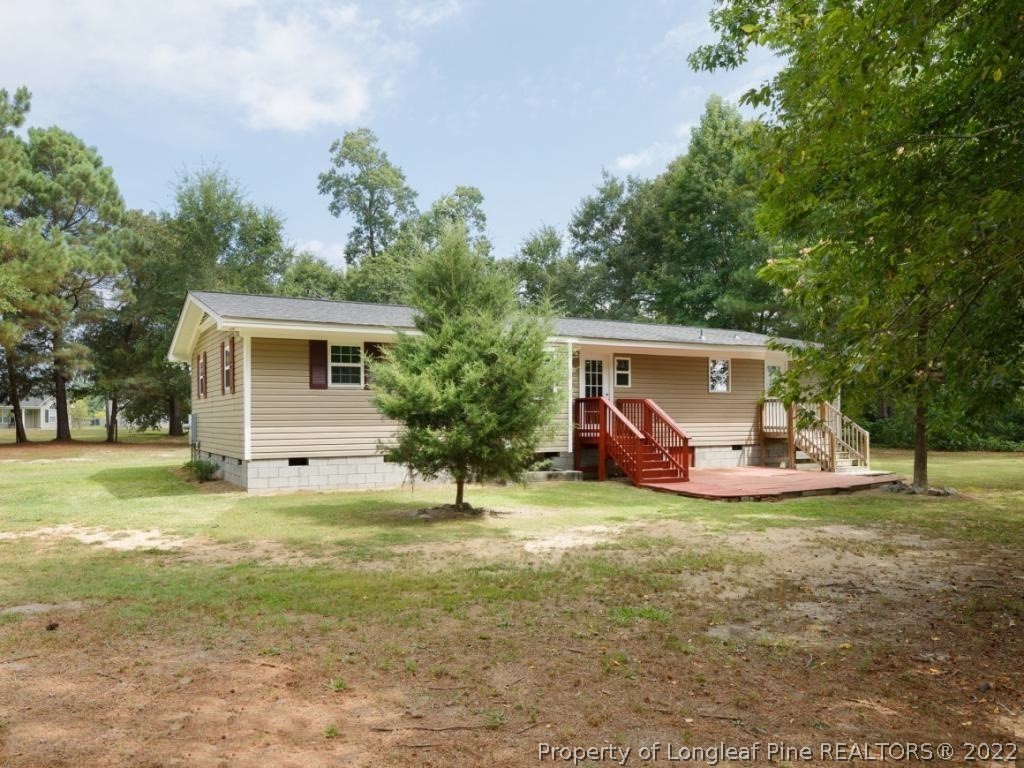 7661 Rufus Johnson Road, Unit 2 Fayetteville, NC 28306 - Photo 14 of 14 a view of a house with backyard
