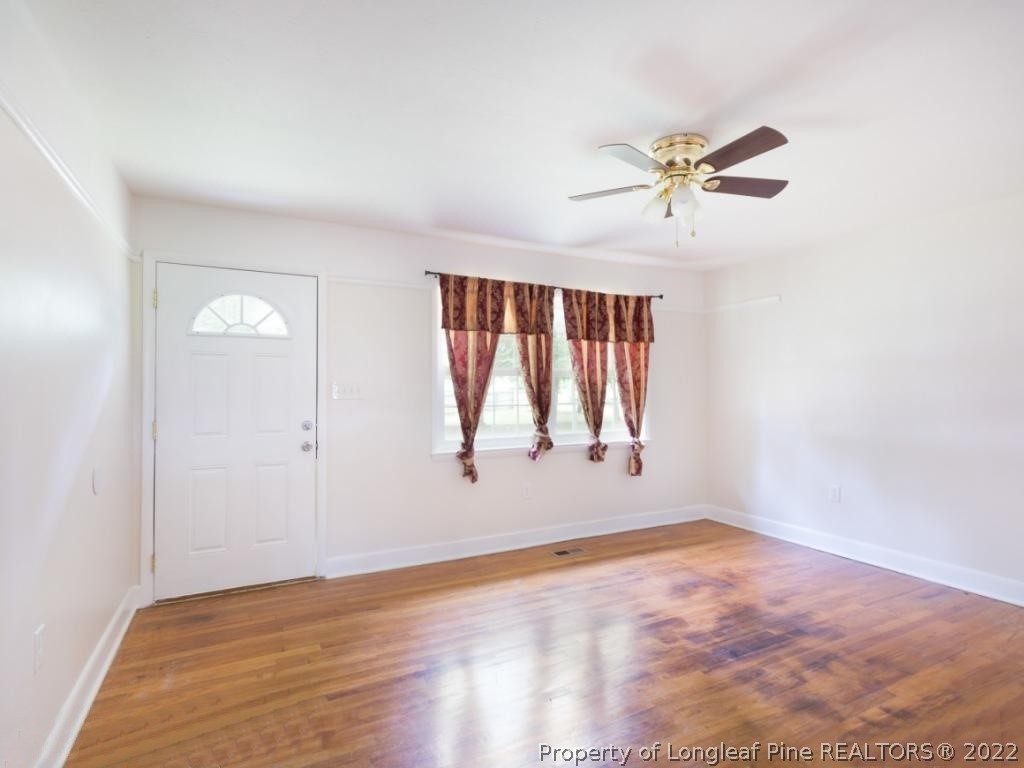 7661 Rufus Johnson Road, Unit 2 Fayetteville, NC 28306 - Photo 2 of 14 a view of room window and ceiling fan