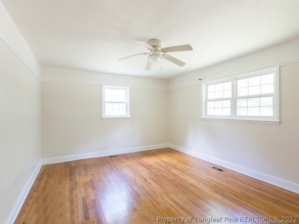 7661 Rufus Johnson Road, Unit 2 Fayetteville, NC 28306 - Photo 9 of 14 a view of a room with wooden floor and windows