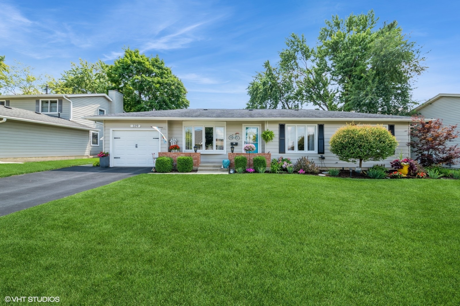 339 Yarmouth Road Elk Grove Village, IL 60007 - Photo 3 of 40 a front view of house with yard and green space