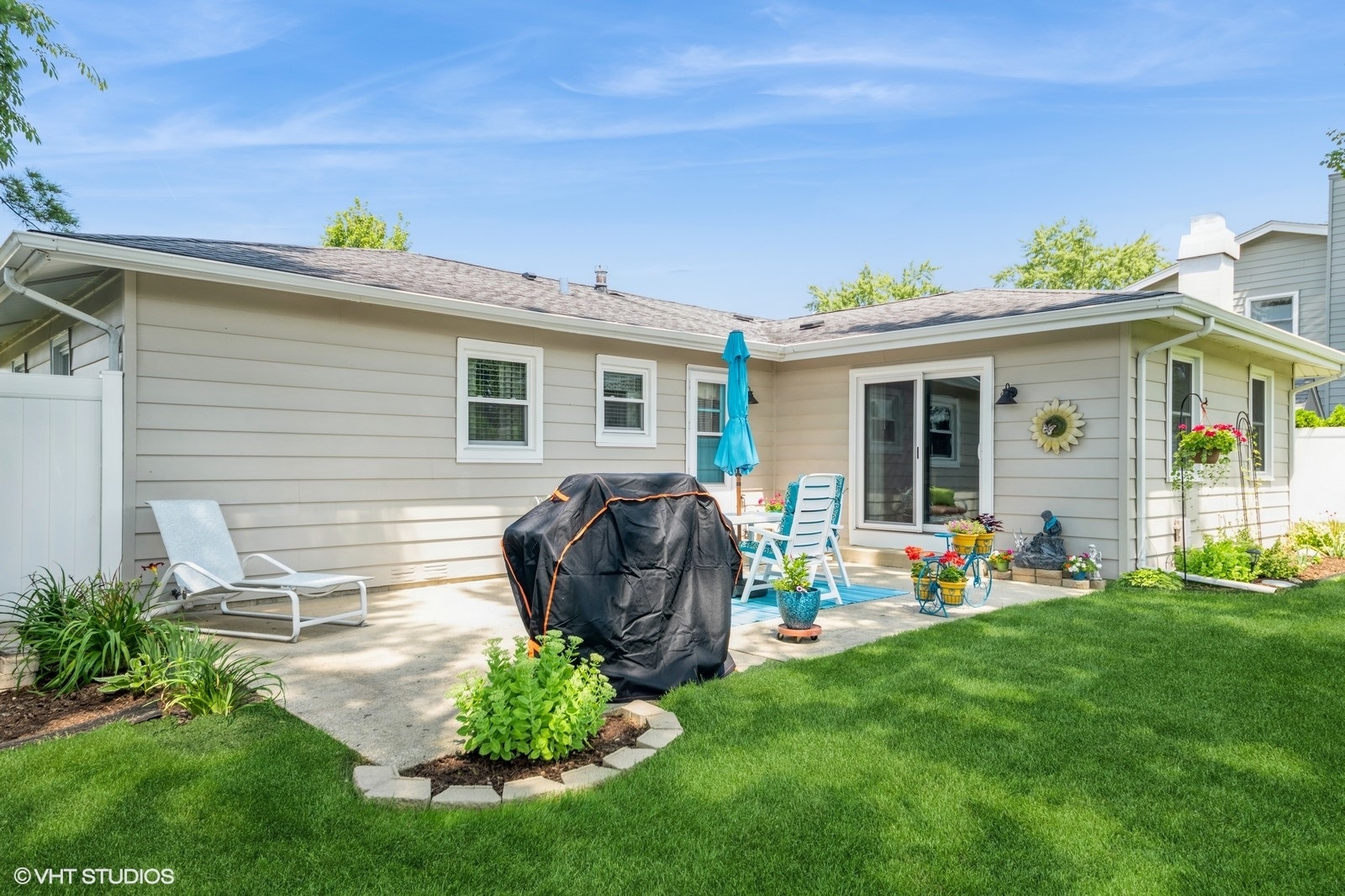 339 Yarmouth Road Elk Grove Village, IL 60007 - Photo 35 of 40 a view of backyard with table and chairs and potted plants
