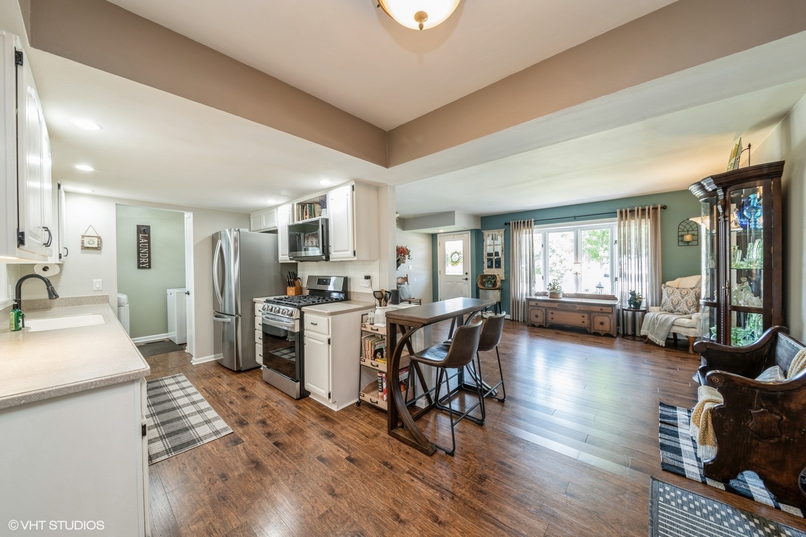339 Yarmouth Road Elk Grove Village, IL 60007 - Photo 6 of 40 a kitchen with sink cabinets and wooden floor