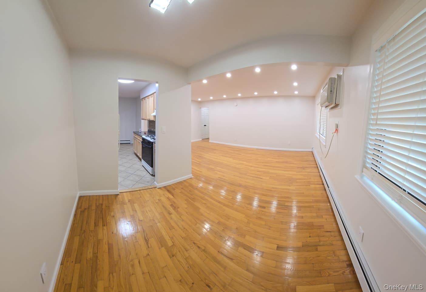 15 Brevoort Drive, Unit 1B Pomona, NY 10970 - Photo 4 of 7 a view of a big room with wooden floor and windows